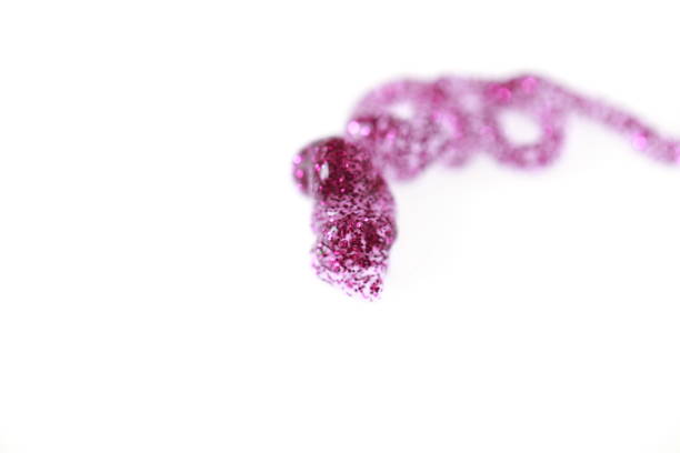 istock transparent varnish with pink sparkles spiral pattern 857546218