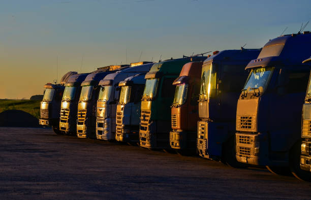 istock Multiple trucks park in a large parking lot. 857549454