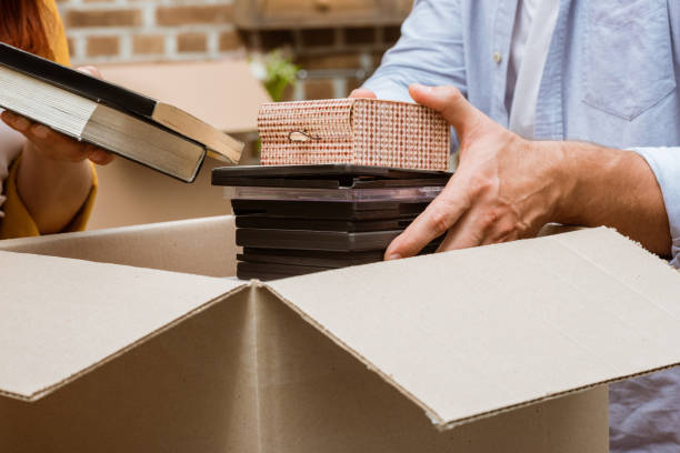 istock couple unpacking box at home 857565646
