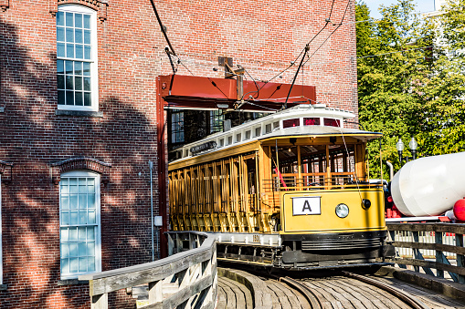 old historic yellow streetcar in Lowell, USA