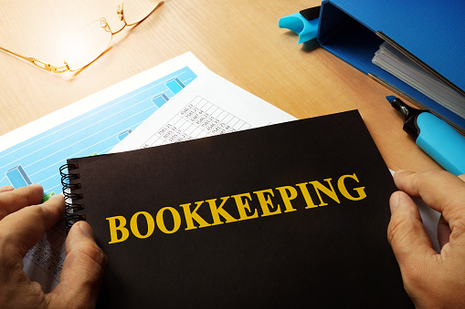 Bookkeeping written on a front of note.