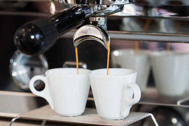 istock Two cups of espresso in the coffee machine 857574666