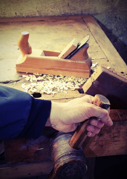istock hand of the carpenter and the workpiece vice with over a plate 857575076