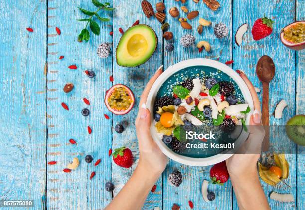 Smoothie Bowl With Fresh Berries Nuts Seeds Fruit And Vegetables Stock Photo - Download Image Now