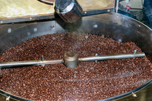 istock coffee beans are fried in a vessel, bokeh 857575390