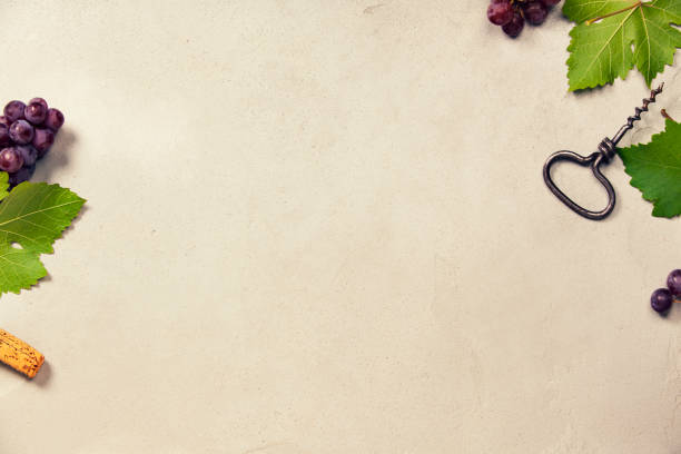 istock Wine and grapes over grey concrete background 857582340