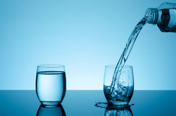 istock Creative splashing water in the glass 857582364