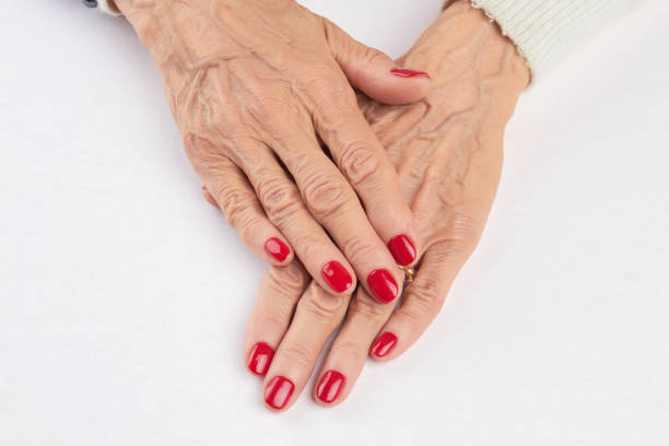 istock Female hands with red manicure. 857582940