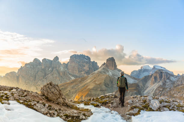 istock Woman alone trekking on the mountain path 857586338