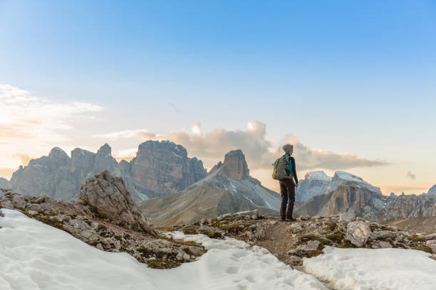 istock Woman alone trekking on the mountain path 857586342