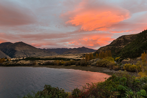 The sunrise at Glendhu Bay near Wanaka in Autumn beside the lake