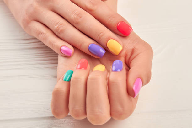istock Female hands with stylish summer manicure. 857591748