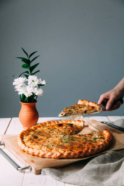 homemade pastries with fillings of potatoes, cabbage and fish - baked breakfast cabbage cake imagens e fotografias de stock