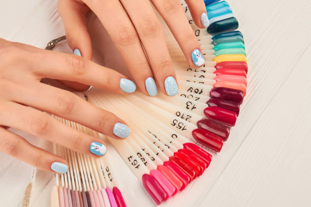 istock Manicured hands and collection of nail samples. 857592958
