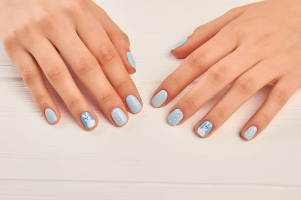 istock Winter design manicure on female hands. 857593116