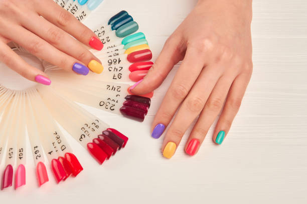 istock Well-groomed hands and nail color samples. 857595814