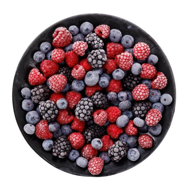 istock Frozen juicy and ripe berries in a black plate isolated on white background, top view 857599708