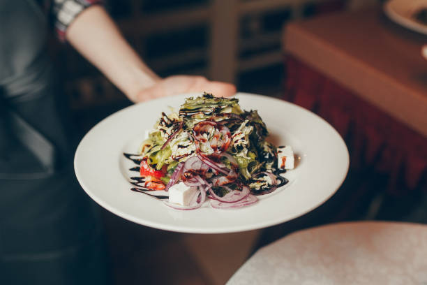 istock hot meals and salads in the hands 857608888