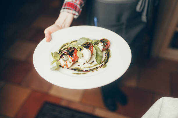 istock hot meals and salads in the hands 857608908