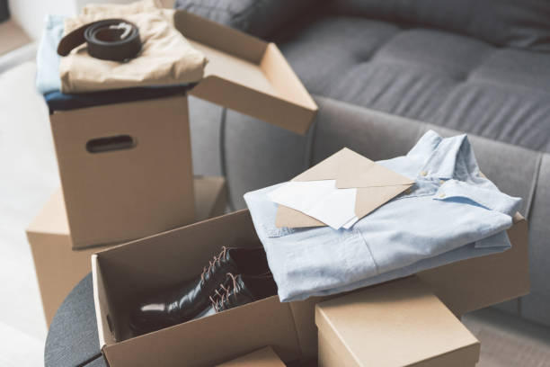 istock Packages with shirts locating in apartment 857609948