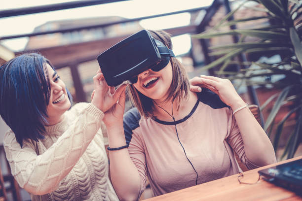 istock Young Woman Having Fun with Virtual Reality Simulator and Gesturing 857609956
