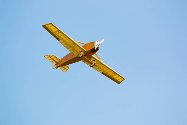 istock Vintage yellow airplane in blue sky 857612688