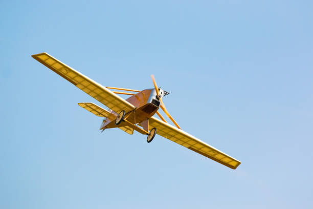istock Vintage yellow airplane in blue sky 857612692