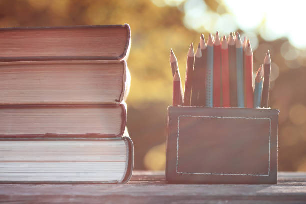 istock autumn book stack wooden outdoor 857618358