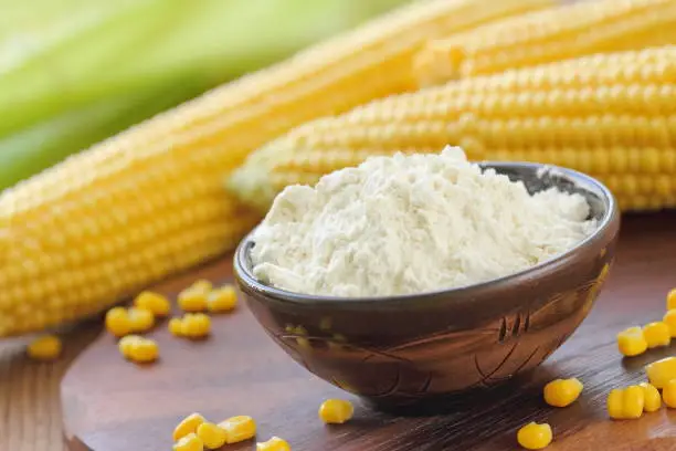 Photo of Corn flour and corn cob on the table