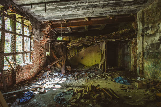 istock Inside ruined red brick industrial building. Abandoned and destroyed by earthquake, bomb, terrorist attack 857624144