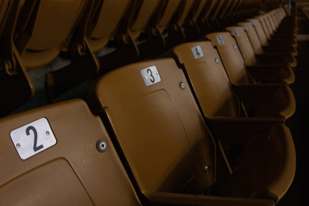 Stadium Seating in arena light brown stadium seating in a basketball arena or concert venue baseball stadium chairs stock pictures, royalty-free photos & images