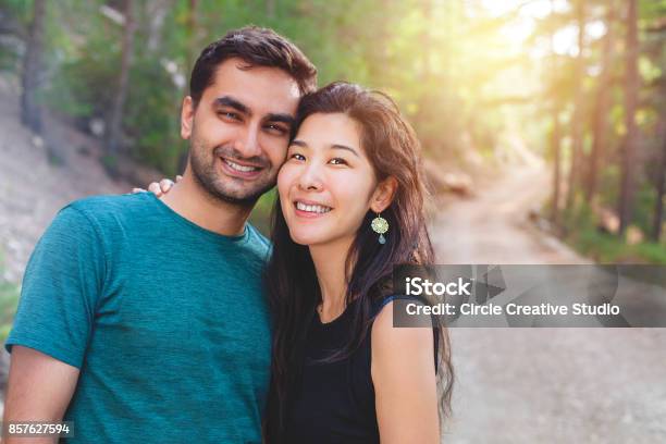 Young Japanese Woman And Indian Man Couple Stock Photo - Download Image Now - Couple - Relationship, Multiracial Group, Young Couple