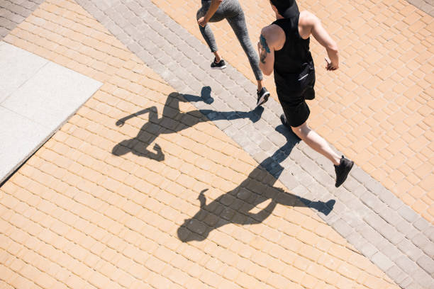 istock couple jogging on street 857630588