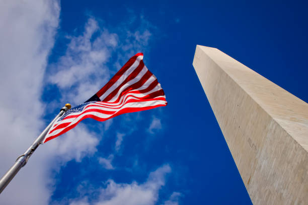 istock Washington Monument and American Flag. 857630934
