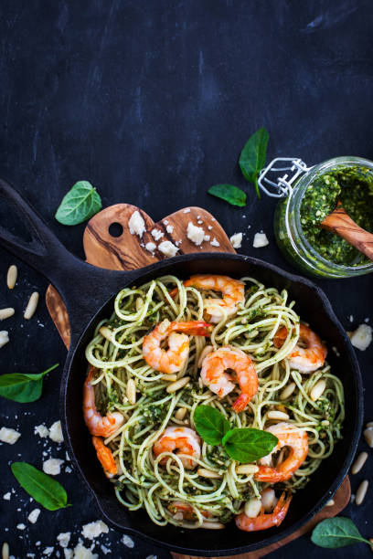 istock Spaghetti with prawns and homemade pesto sauce 857631640