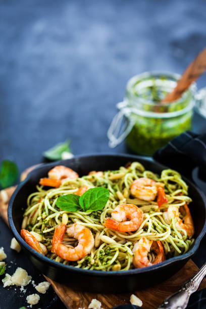 istock Spaghetti with prawns and homemade pesto sauce 857631642