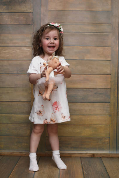 istock Little girl with curly hair, having fun while posing 857637326