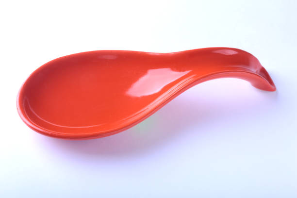 istock red portionen plate. isolated on white. selective focus close-up shot. 857637798