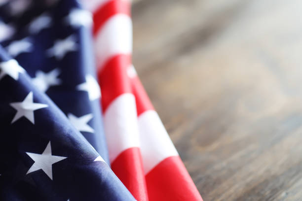 istock American flag on a wooden texture table 857642690