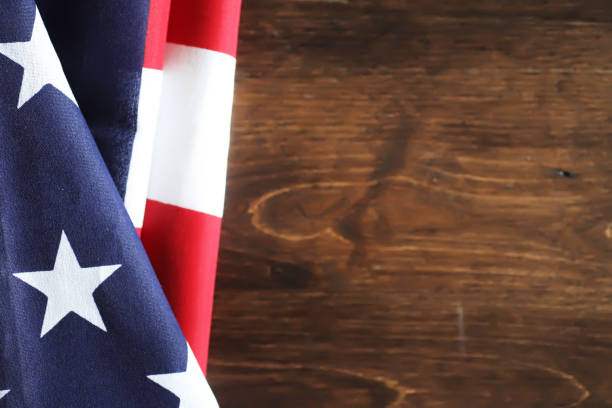 istock American flag on a wooden texture table 857642814