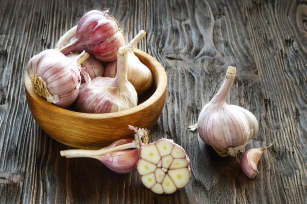 istock Garlic in a wooden bowl 857642868