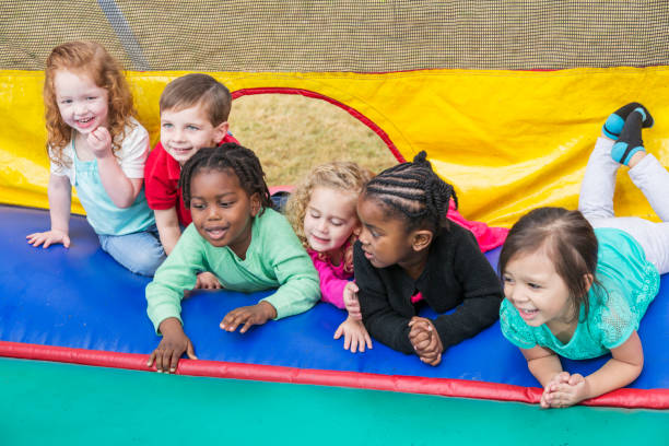 istock Multi-ethnic group of children in bounce house 857645076