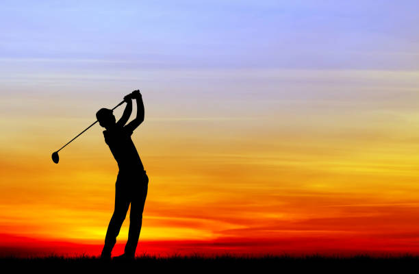 istock silhouette golfer playing golf during beautiful sunset 857645218