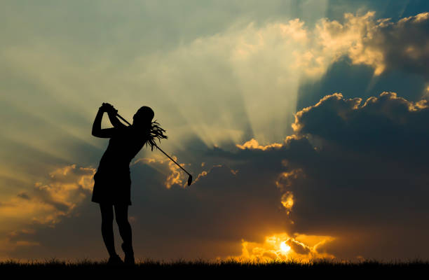 istock silhouette golfer playing golf during beautiful sunset 857645228