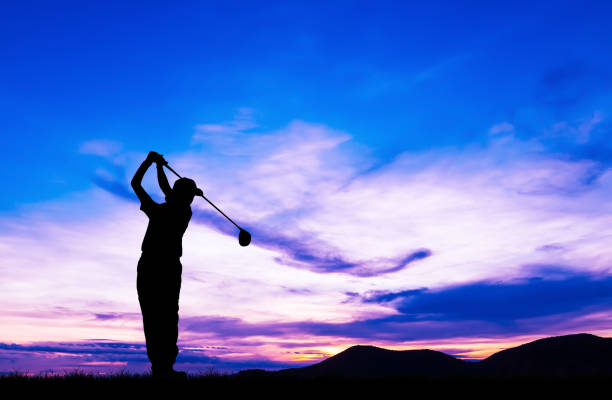 istock silhouette golfer playing golf during beautiful sunset 857645240