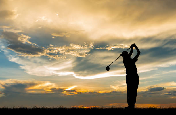 istock silhouette golfer playing golf during beautiful sunset 857645246
