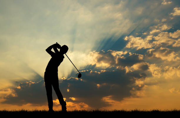 istock silhouette golfer playing golf during beautiful sunset 857645252