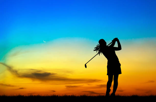 istock silhouette golfer playing golf during beautiful sunset 857645312