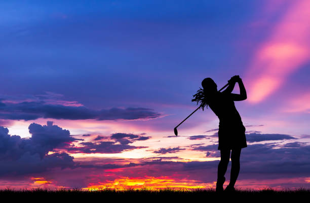 istock silhouette golfer playing golf during beautiful sunset 857645330