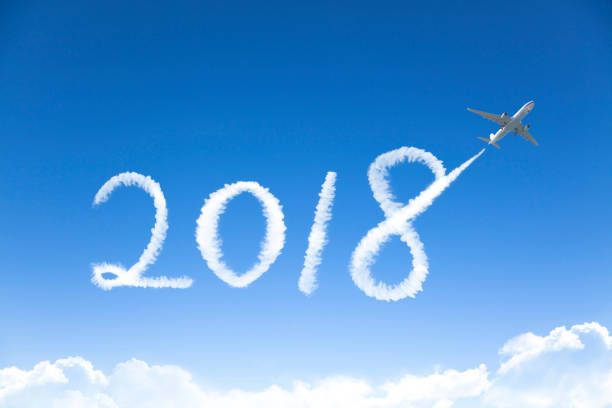 istock happy New year 2018 concept.drawing by airplane in sky 857645634